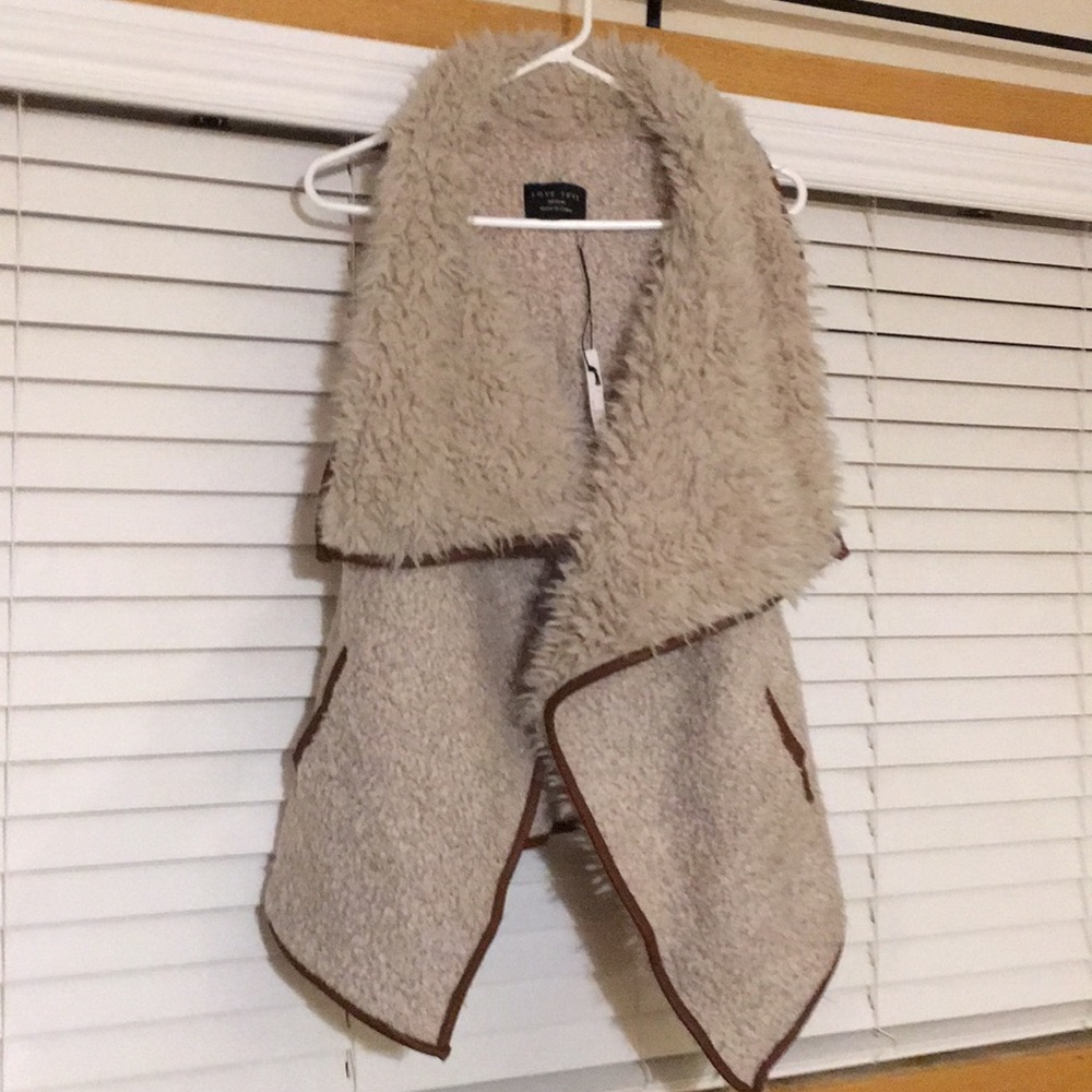 Women’s Faux Fur vest with leather piping. New!